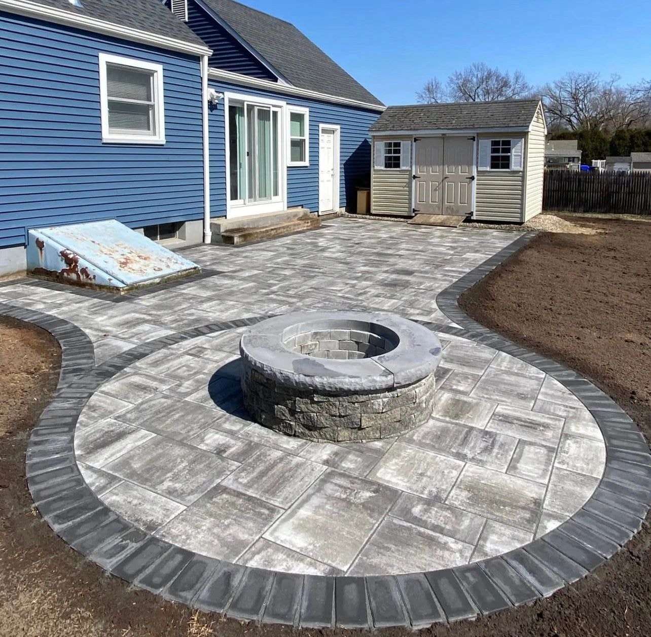 Circular fire pit with surrounding stone seating