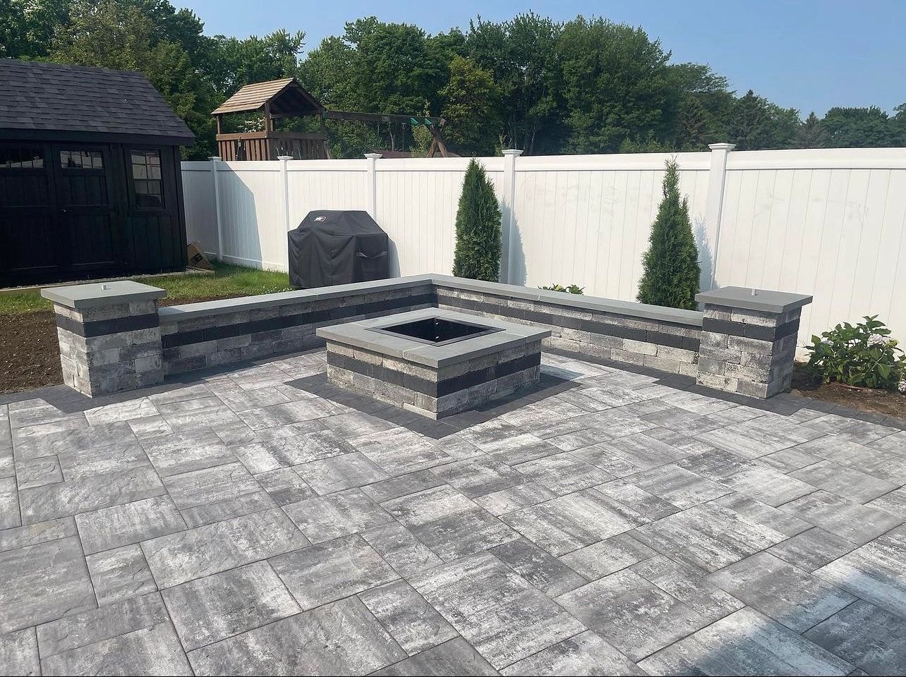 Custom bluestone patio with built-in seating wall